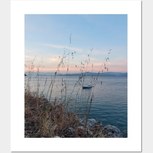 Serene Ocean Sunset: Boat Amidst Weeds Posters and Art